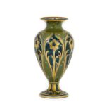 William Moorcroft (1872-1945) for James Macintyre: A Green and Gold Florian Pattern in Green Vase,