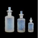 Three Art Deco Sabino Opalescent Glass Perfume Bottles, in graduating size, moulded with bathing