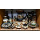 Collection of Gouda pottery to include a large bowl, decanter and stopper, various candlesticks,