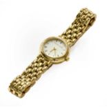 A lady's 9 carat gold wristwatch, signed Bueche GirodGross weight - 22.4gramsThe bracelet clasp