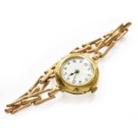 A lady's 18 carat gold enamel dial wristwatch, case with London import mark for 1913, attached