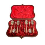 A cased set of six Victorian engraved silver teaspoons and pair of sugar tongs by John Round &