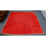 A late 19th century turkey red wholecloth quilt with cream to the reverse, 190cm by 210cmFading to