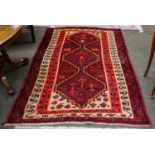 Fars rug, the field with three stepped medallions, enclosed by triple borders 191cm by 136cm