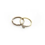 A diamond solitaire ring, stamped '18CT&PLAT', finger size L; and a band ring, stamped '18CT',