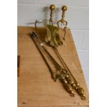 A set of brass fire tools, another set of steel tools and pair of brass andirons (8)