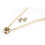 A two row cultured pearl necklace, knotted to a blue zircon and cultured pearl clasp, length 39.5cm;
