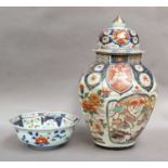A Japanese large Imari octagonal baluster jar and cover, Edo period, with lappet borders and