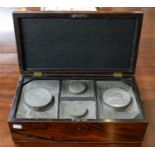 A Regency rosewood tea caddy, fitted with four compartments, containing Chinese pewter canisters,