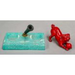 A Bernard Moore flambe glazed model of a pug dog with a ball, signed, (a/f), 9.5cm, together with