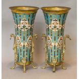 A pair of 19th century French bronze and champleve enamel vases of tapering form, with twin mask and
