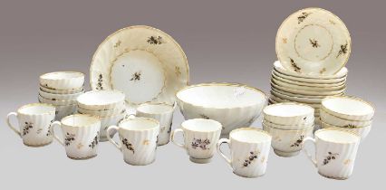 An English Porcelain Tea and Coffee Service, circa 1795, of wrythen fluted form, painted in black