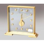 A Jaeger LeCoultre brass mantel timepieceBrass case is slightly discoloured in parts, front glass