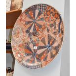 A Japanese Meiji period brocade pattern Imari charger, 56cm diameter (a/f)