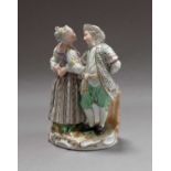 A Meissen figure group, a lady and gent country dancing posed do-si-do, underglaze crossed swords