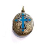 An oval enamel locket, the blue enamelled cross motif within a foliate engraved border, with hair