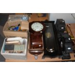 A quantity of clock parts including, clock spandrels, bells, hands, longcase clock white dials,