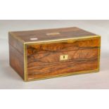 A 19th century brass mounted rosewood vanity box fully fitted and with contents, the leather stamped