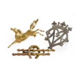 A horse brooch, stamped '750', length 4.8cm; a 9 carat gold horseshoe motif brooch, length 5.3cm;