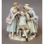 A Meissen figure group, late 19th century, modelled as a lady and housekeeper flanking a seated