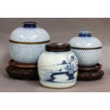 An 18th century Chinese provincial blue and white ginger jar with associated hardwood cover, two