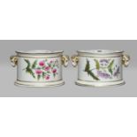 A pair of Derby bough pots, circa 1795, with pierced covers, moulded ram mask handles and each