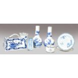 A pair of Chinese blue and white bottle vases, Kangxi marks but 19th century, painted with figures