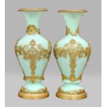 A pair of French turquoise opaque glass vases with gilt bronze mounts depicting classical figures