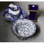 A modern blue and white-footed bowl with metal mounts and a reproduction blue and white printed