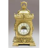A French brass cased mantel timepiece, Arabic enamelled dial, single barrel movement with