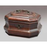 An 18th-century mahogany tea caddy, moulded octagonal cover fitted with a handle on a waisted