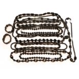 A quantity of jet and jet type necklaces and bracelets, varying designs and lengths