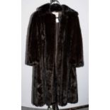 Blackglama Northern Export Fur of Leeds Dark Brown Mink Coat, with cuffed sleeves and collar. Slight