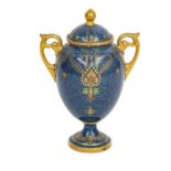 A Royal Worcester twin handled pedestal vase and cover with powder blue ground, edged in gilt and