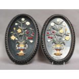 A pair of specimen marble plaques of ovoid form, each depicting an urn overflowing with fruit and