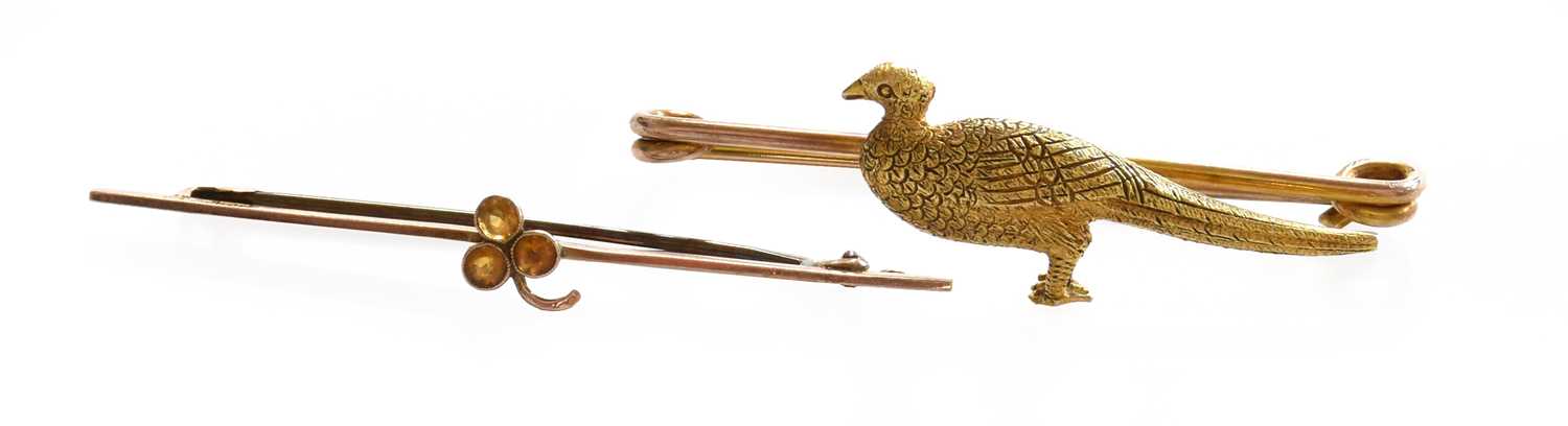 A citrine brooch, stamped '9CT', length 5.4cm; and a pheasant brooch, unmarked, length 5.