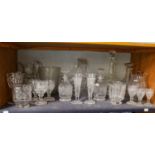 A collection of Georgian and later glass including three-ringed decanter, water jug, part suite of