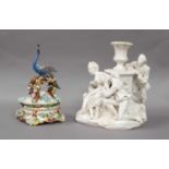An 18th century white glazed Continental faience figural centerpiece modelled as a courting couple