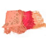 Early 20th Century Silk Evening Shawls, comprising a bright pink example with fringing, 110cm