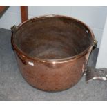 A large 19th-century copper log bin with wrought iron swing handle, 62cm diameter