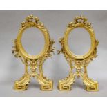 A pair of 19th-century carved and giltwood frames with bird and lorel mounts, and shell and leaf