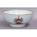 A Chinese armorial punch bowl, Qianlong, painted in coloured enamels and gilt with family crests,