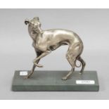 A small silvered bronze sculpture of a greyhound on a marble plinth, 18cm by 9.5cm by 14.5cm