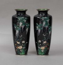 A pair of Japanese Meiji period cloisonne vases, blue ground decorated with birds and wisteria (2)