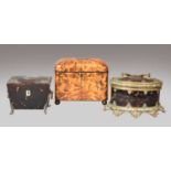 A tortoiseshell tea caddy, 19th century, with white metal mounts and raised on scrolling feet,