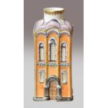 A Lomonosov flask, moulded in the form of a building and coloured in enamels with an orange