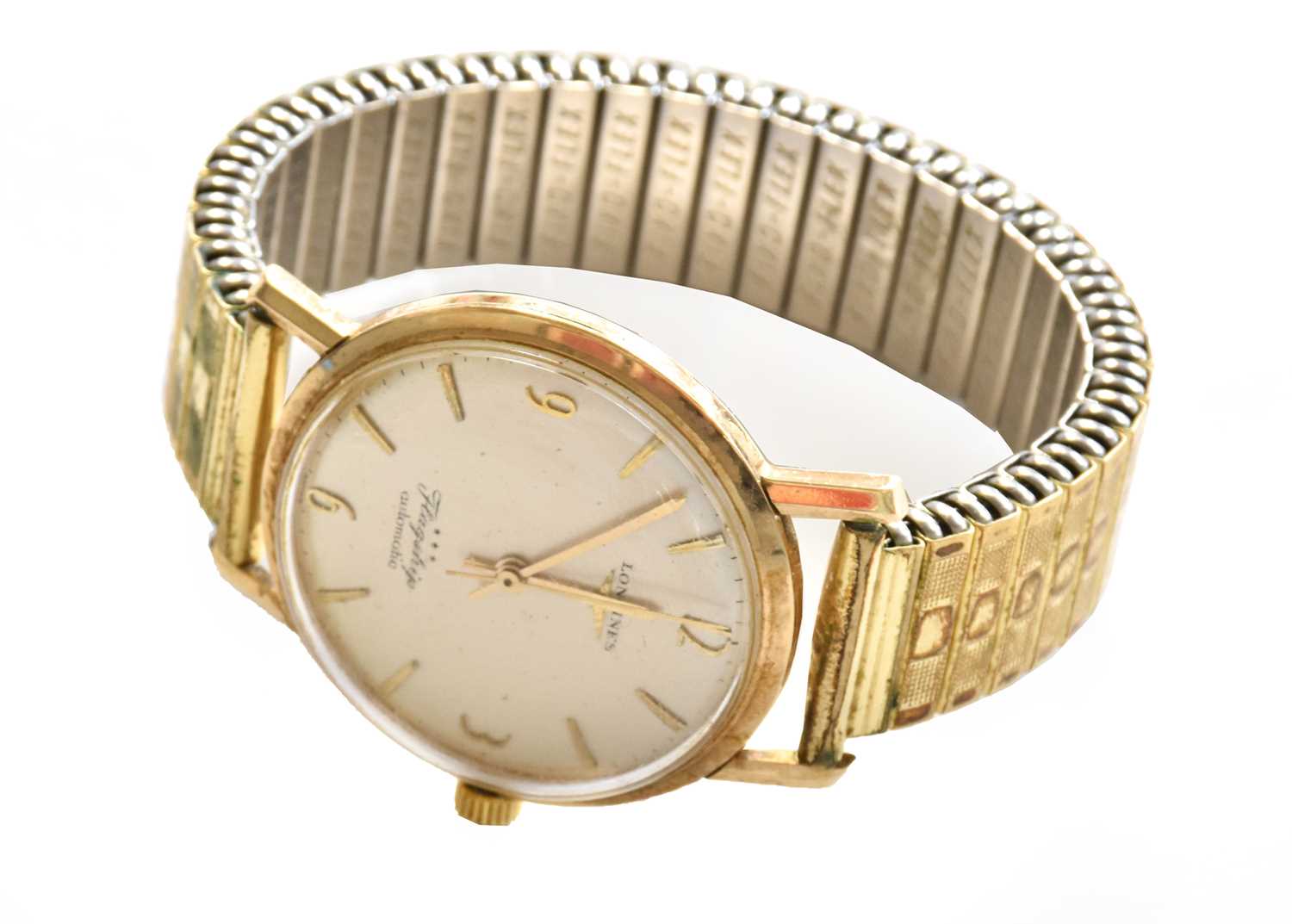 A 9 carat gold automatic centre seconds wristwatch, signed Longines, model: Flagship, 1960's