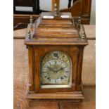 A German oak quarter striking table clock, circa 1900, movement striking on two gongs, backplate