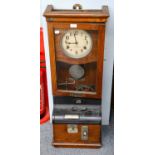 An electric master clock signed Magneta, Time Company Ltd., another electric Master clock signed