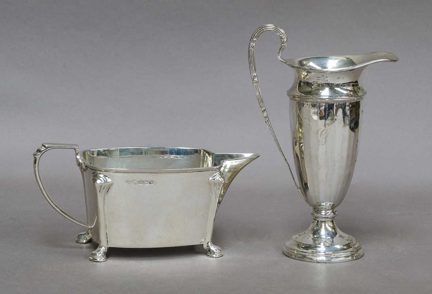 Two Silver Cream Jugs, one by Stower and Wragg Ltd., Sheffield, 1939, oblong and on four pad feet,